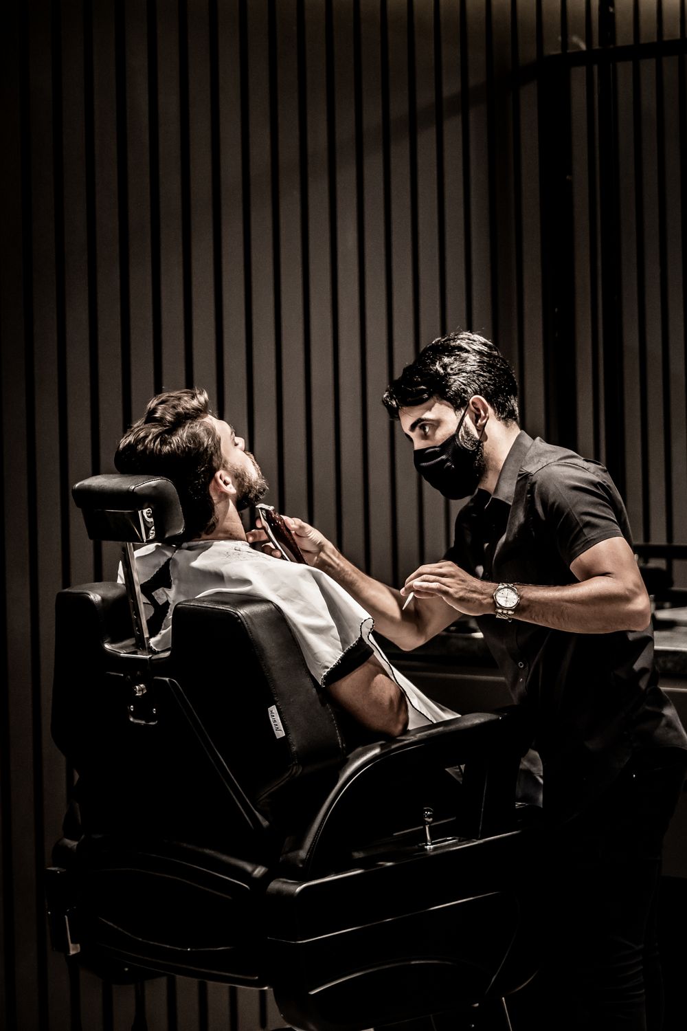Client getting a beard trim and haircut