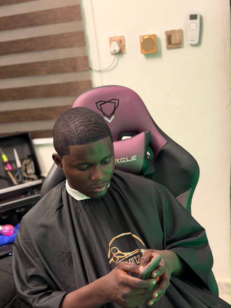 Client relaxing after a styled haircut